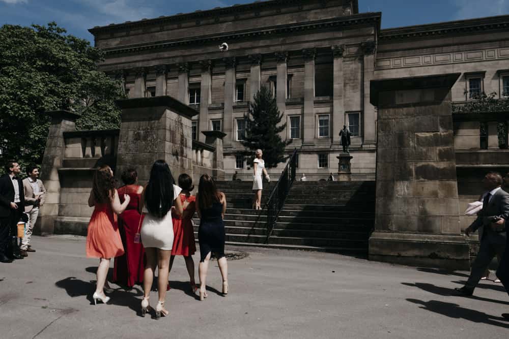 bride throws the bouquet