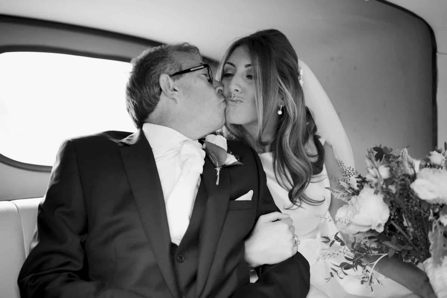 bride and her dad in the car